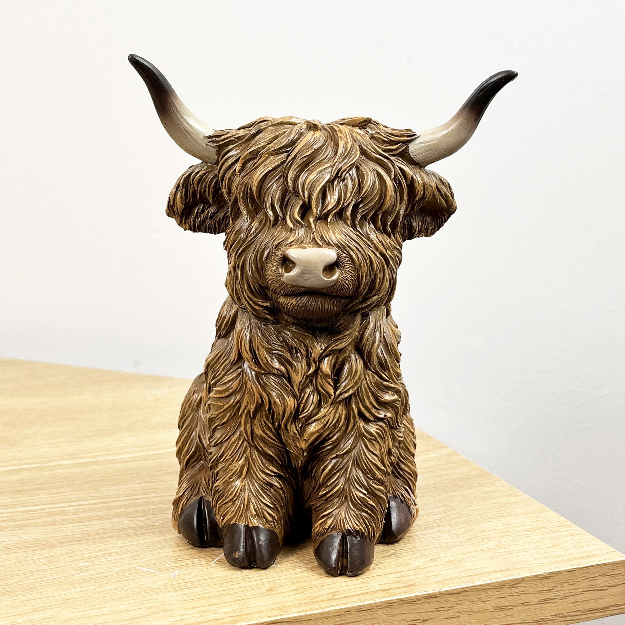 16cm Sitting Highland Cow Ornament - Resin