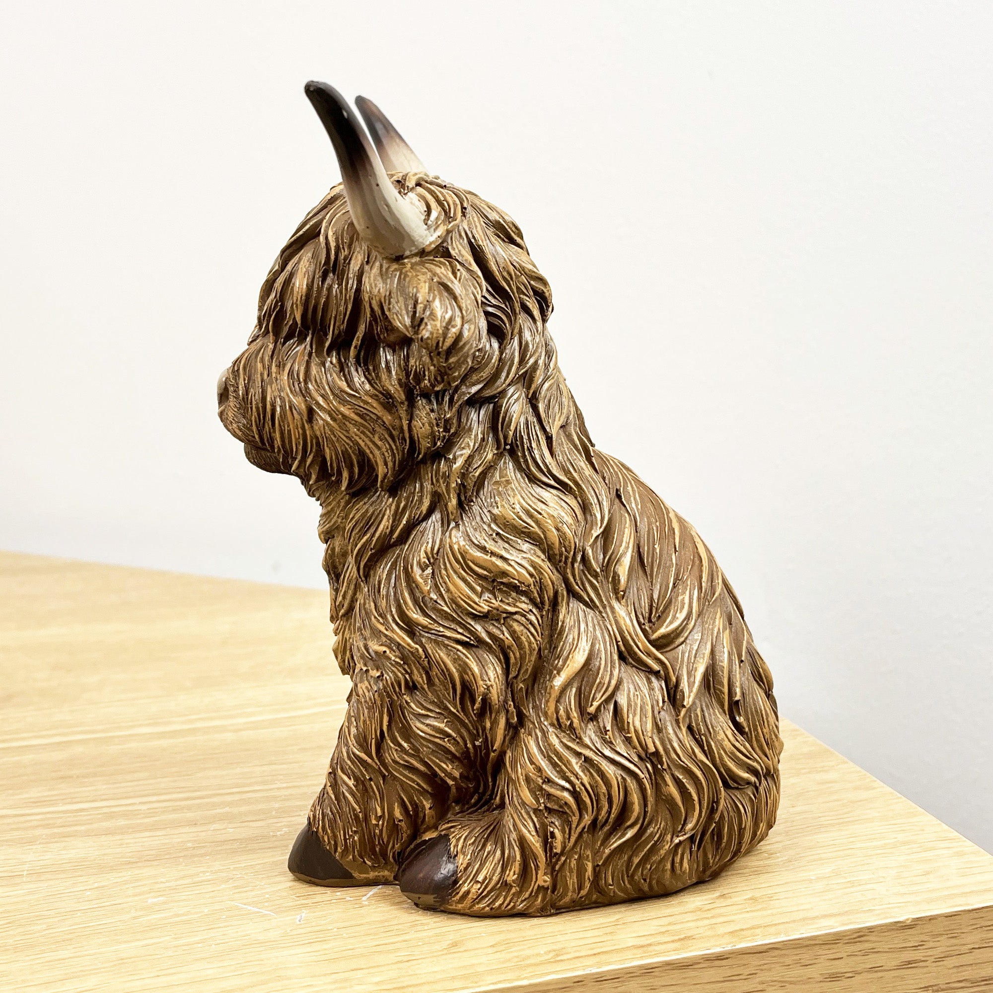 16cm Sitting Highland Cow Ornament - Resin