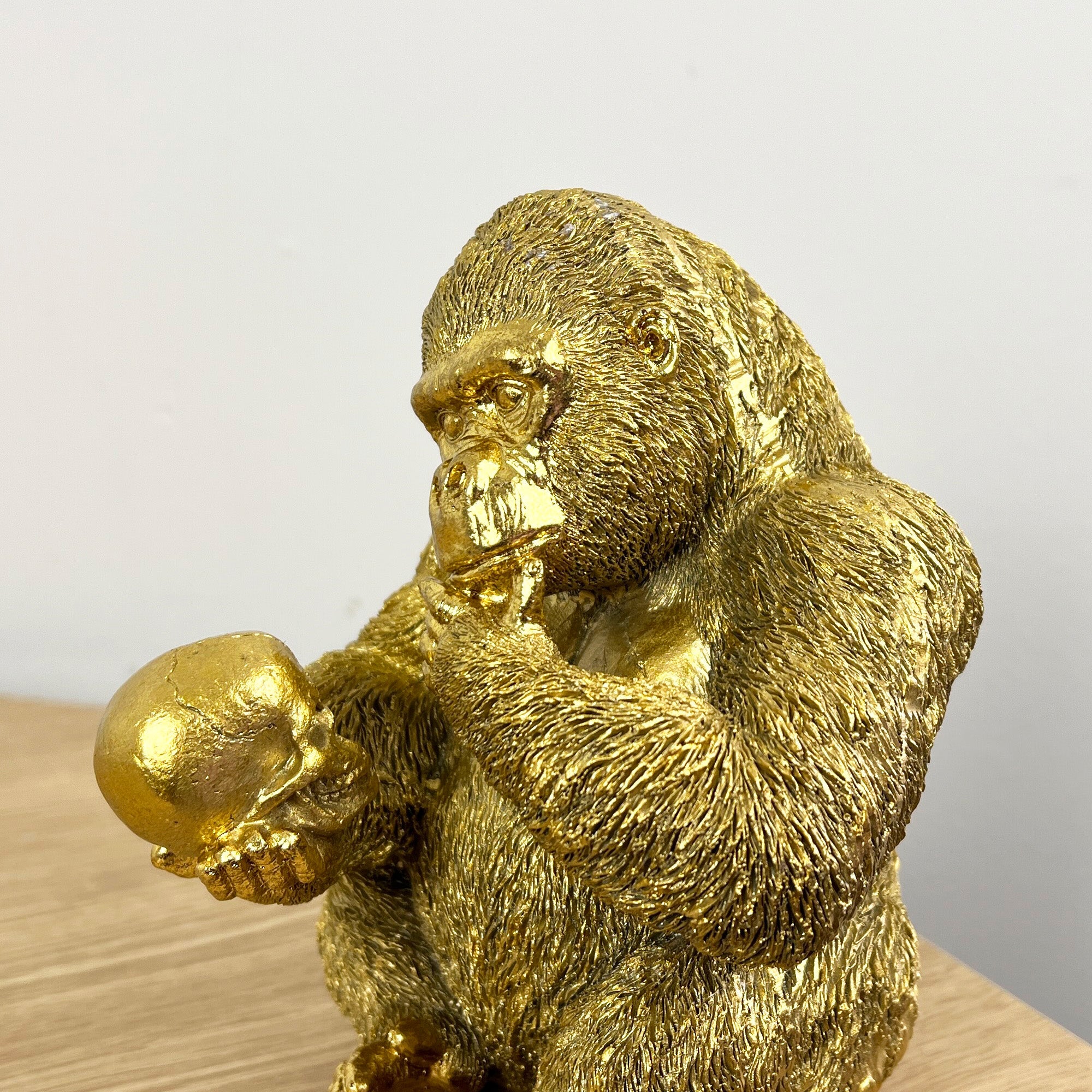 15cm Gold Thinking Gorilla Holding Skull – Resin