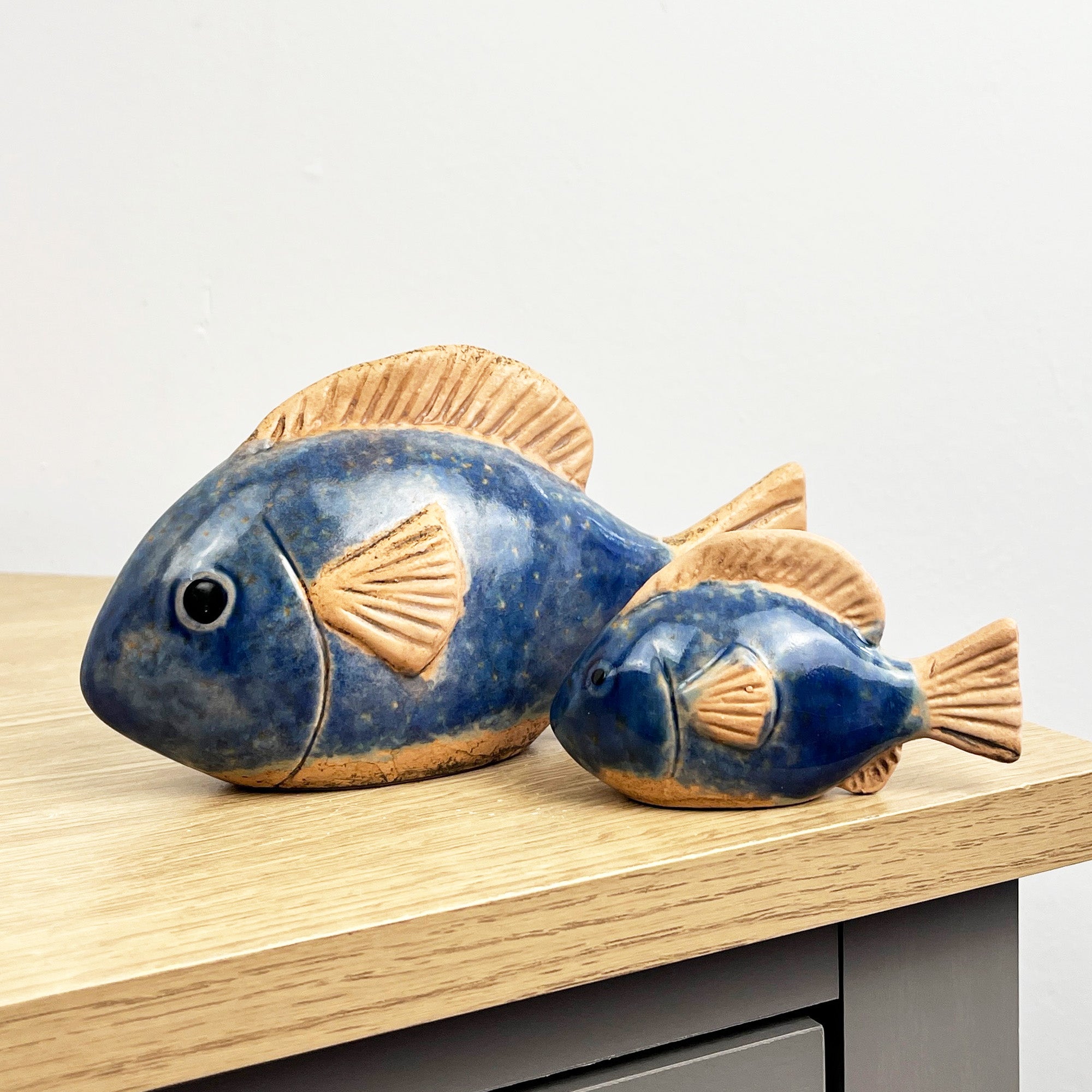 Pair of Blue Glazed Ceramic Fish Ornaments