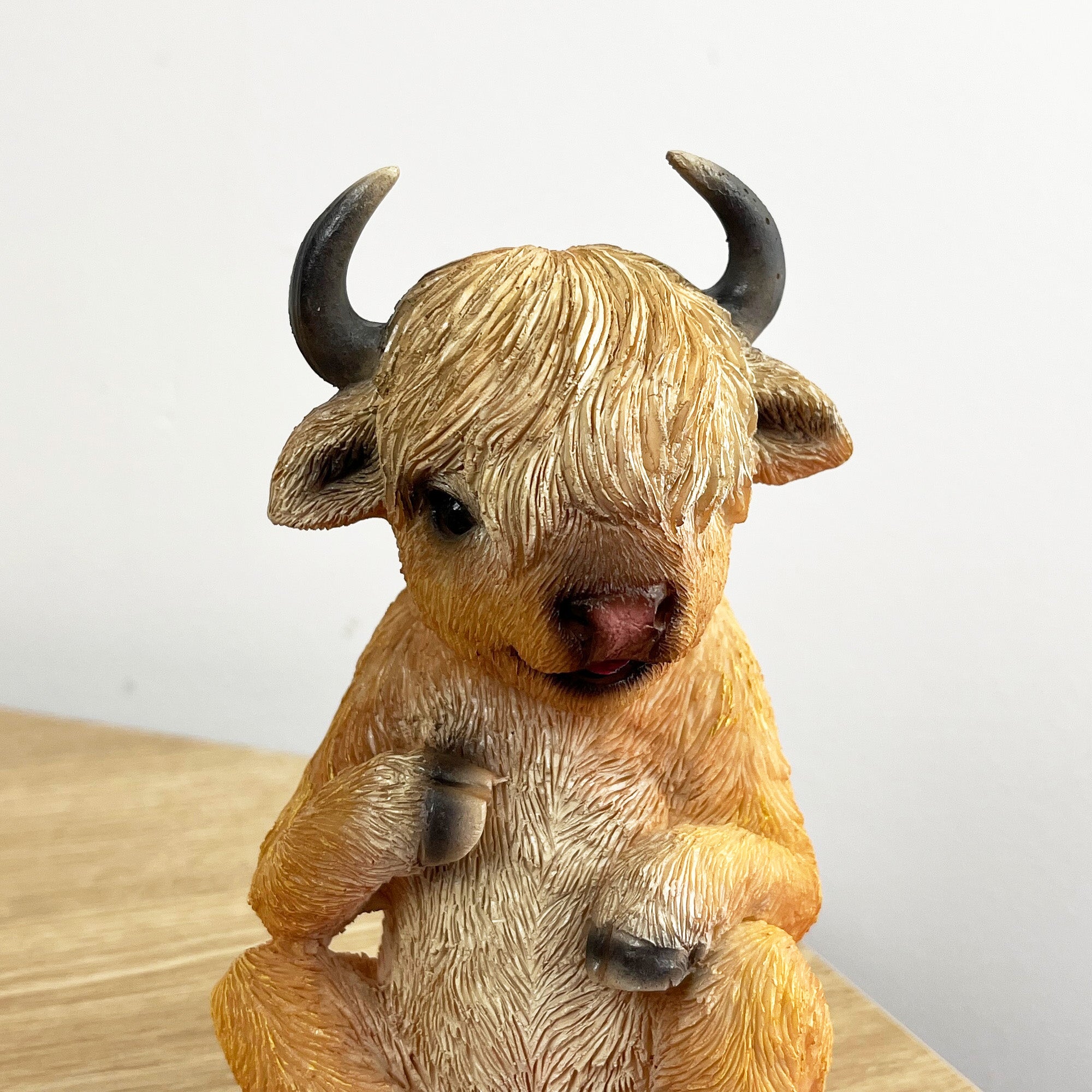 15cm Sitting Highland Cow Ornament – Resin