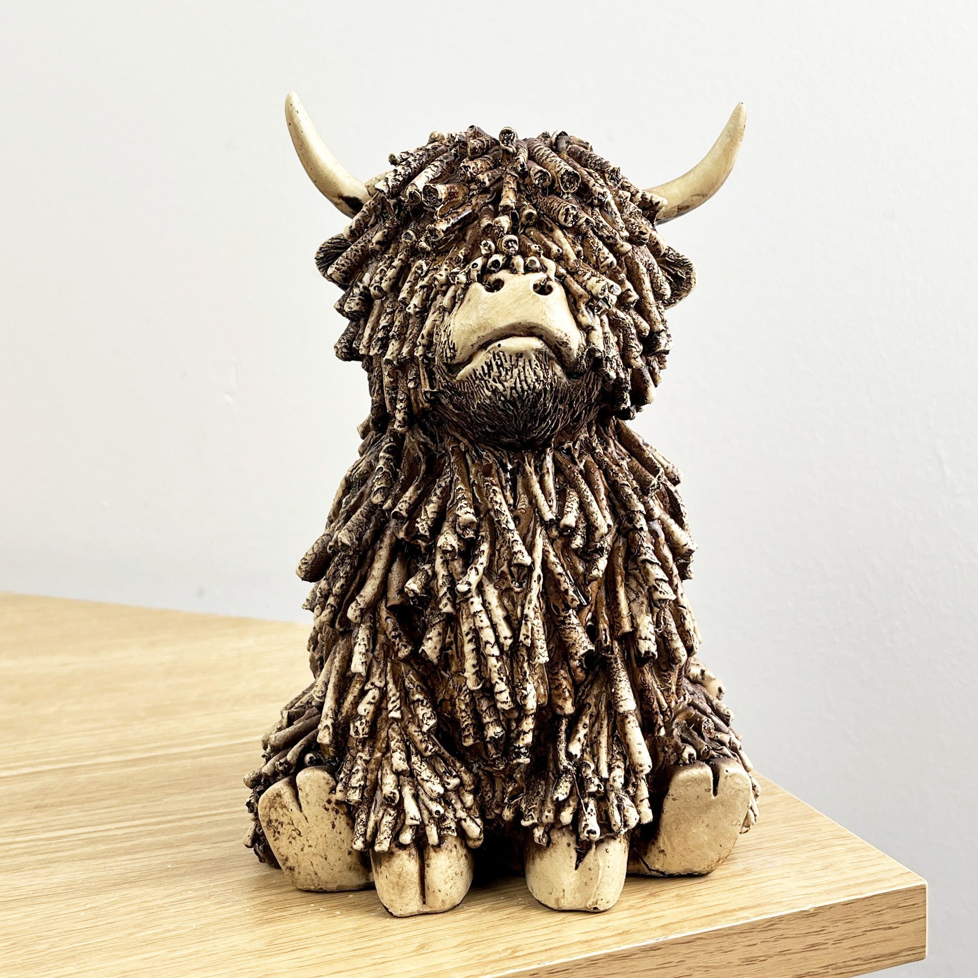 18cm Sitting Highland Cow Ornament / Figurine - Resin