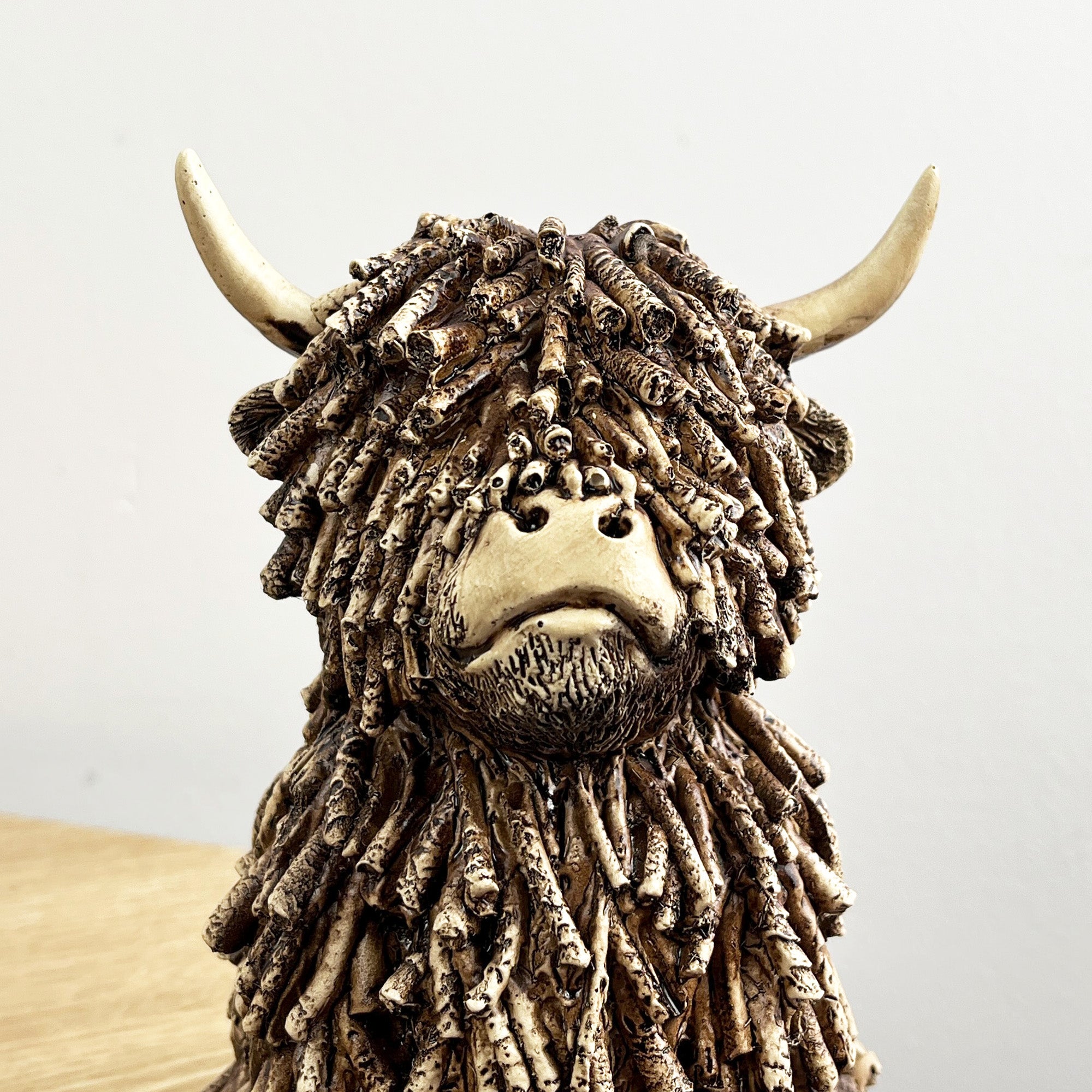 18cm Sitting Highland Cow Ornament / Figurine - Resin