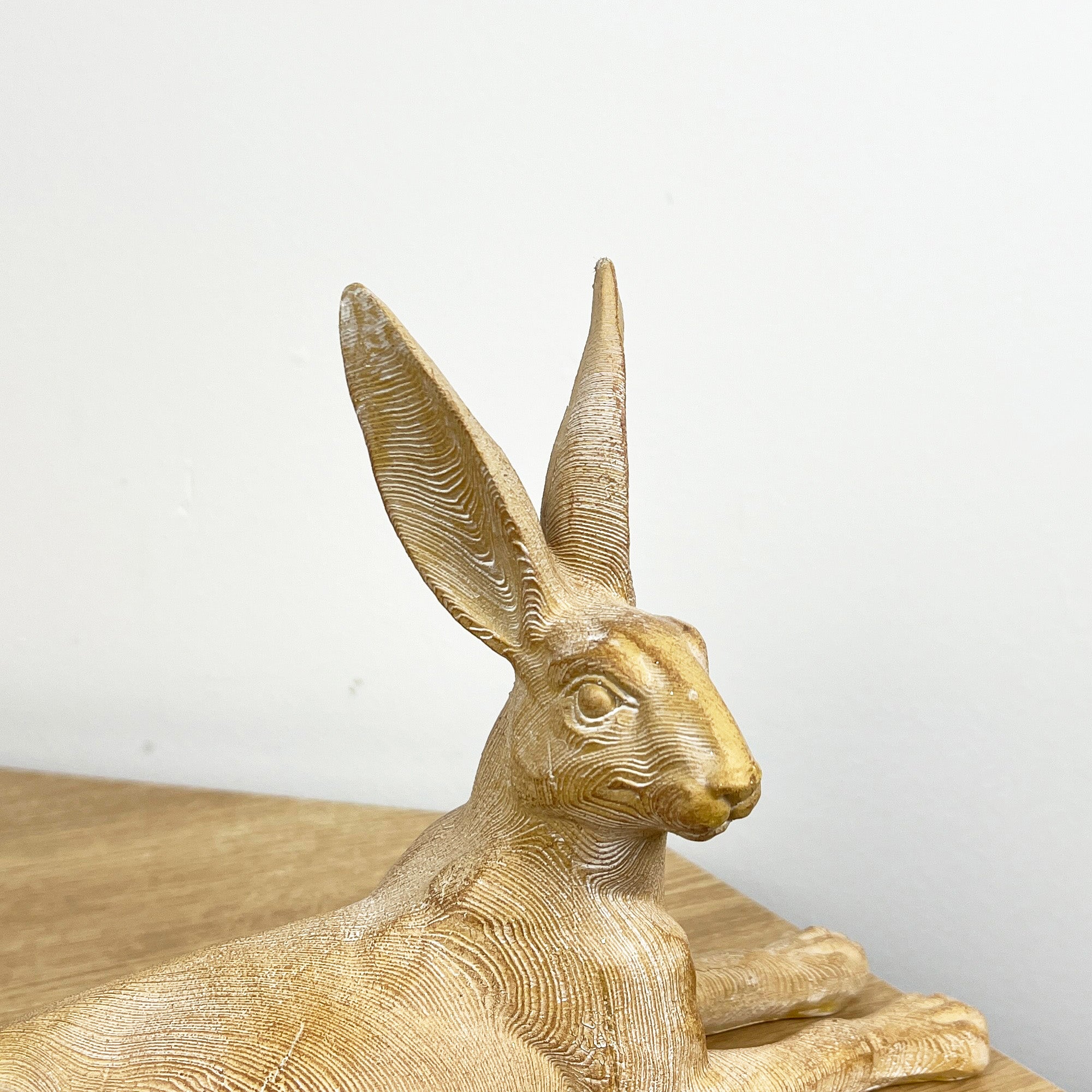 25.5cm Wood Effect Resin Laying Hare Ornament