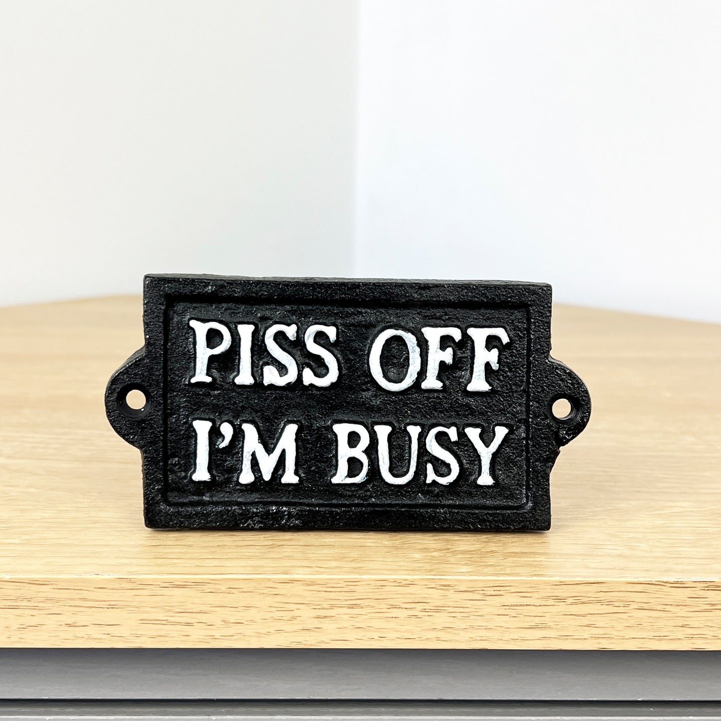 'Piss Off I'm Busy' Cast Iron Wall Sign