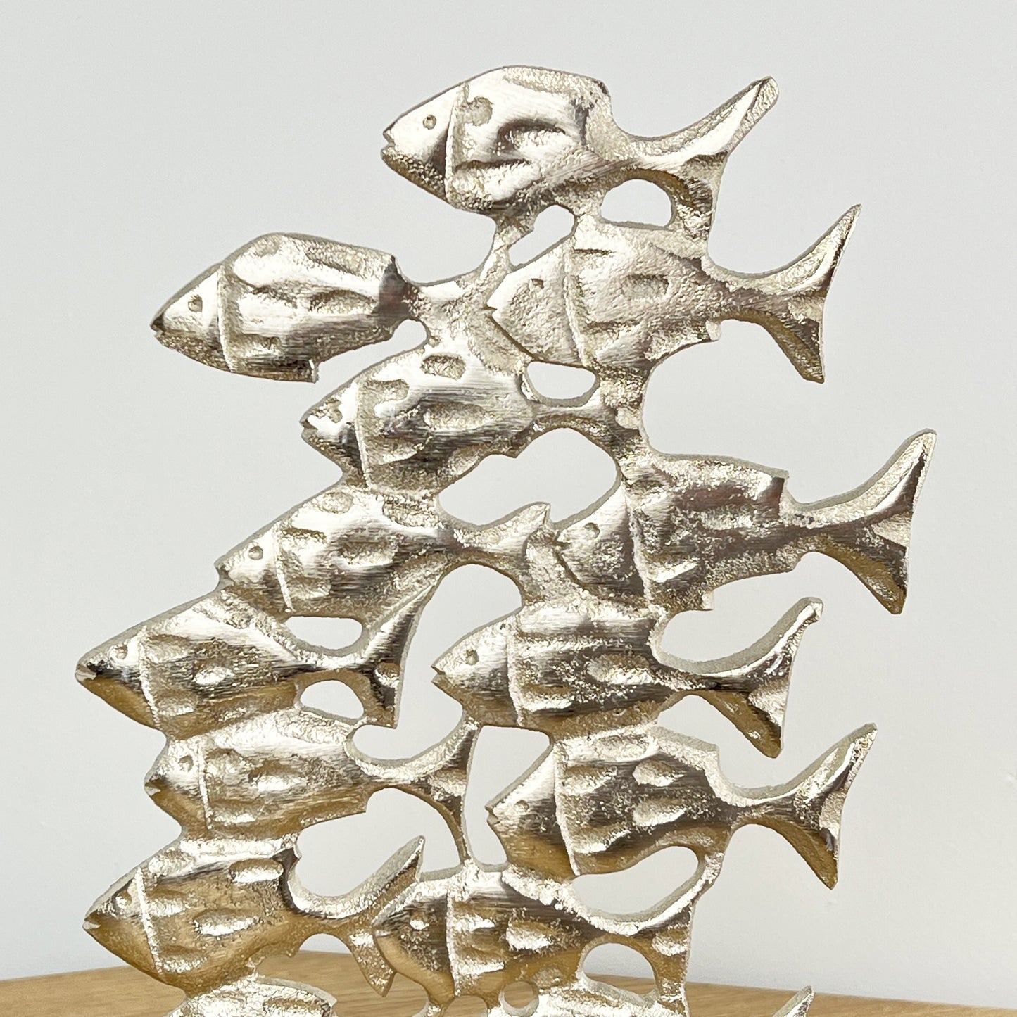 Metal Shoal of Fishes on Wood Ornament